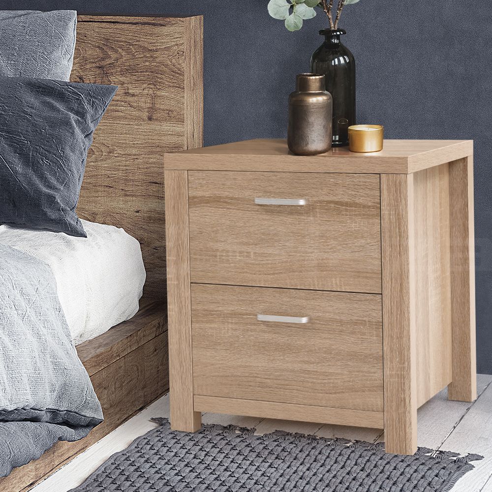 Pair of bedside tables with two drawers in Maxi Pine finish from The Willow Stone Collective, showing smooth wood surface and drawer handles.