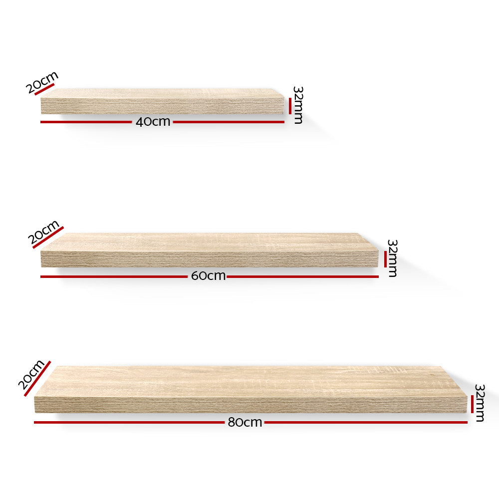 Sturdy oak floating wall shelf set in three sizes from The Willow Stone Collective, ideal for living room storage and decor.