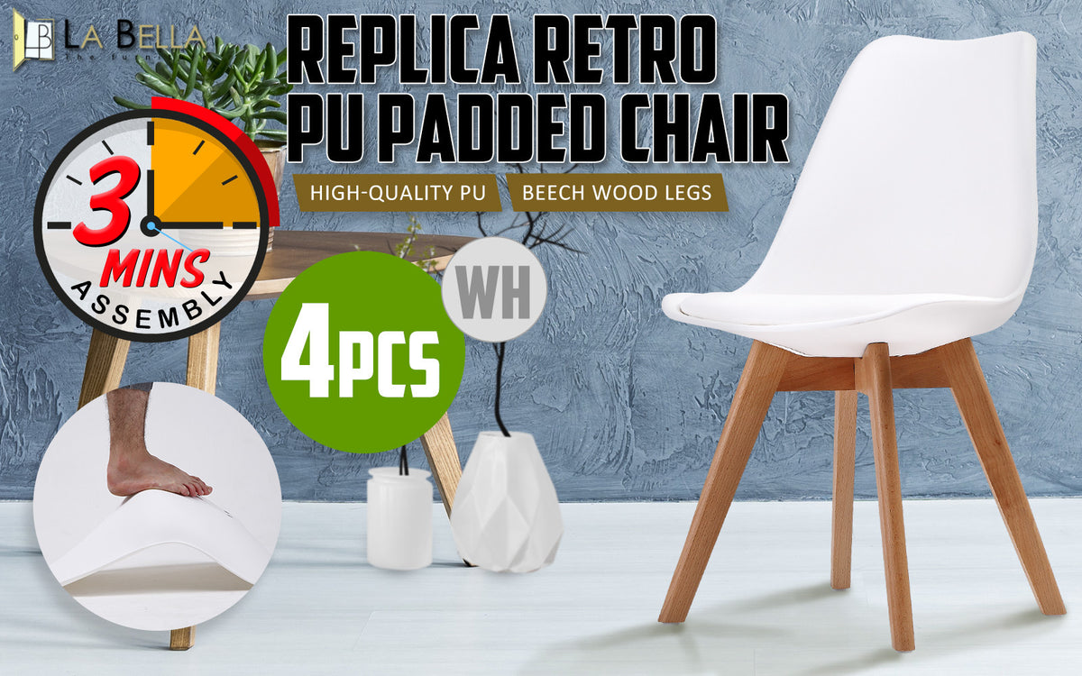 Set of four retro dining chairs with padded white seats and beech wood legs from The Willow Stone Collective.