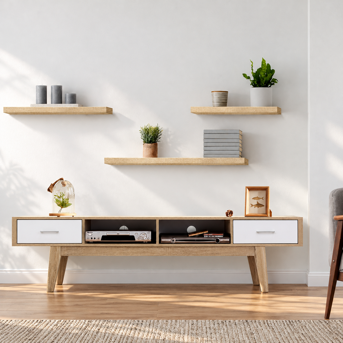 Set of three oak-finish floating wall shelves styled in a bright living room