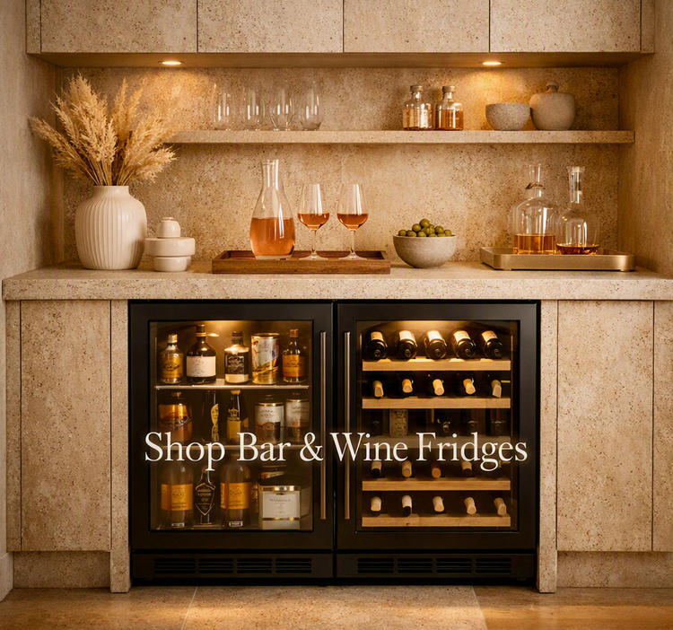 Stylish kitchen featuring premium bar and wine fridges, elegant glassware, and warm timber textures.
