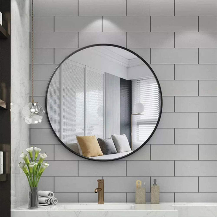 Modern vanity mirrors reflecting a serene bathroom scene with warm tiles and stylish decor accents.
