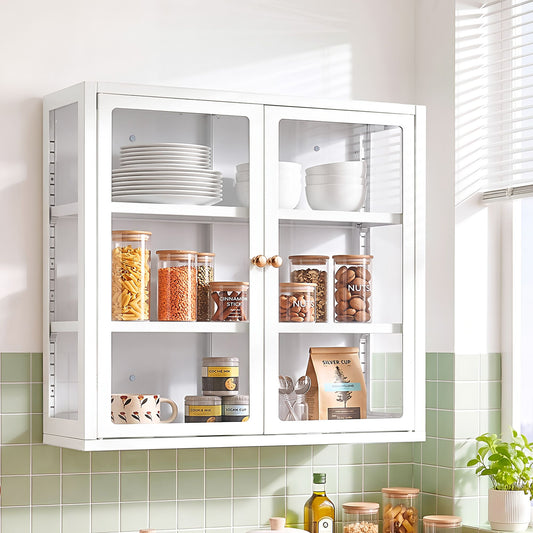Modern glass display cabinet featuring clear glass doors, adjustable shelves and curated kitchenware in a warm, inviting setting.