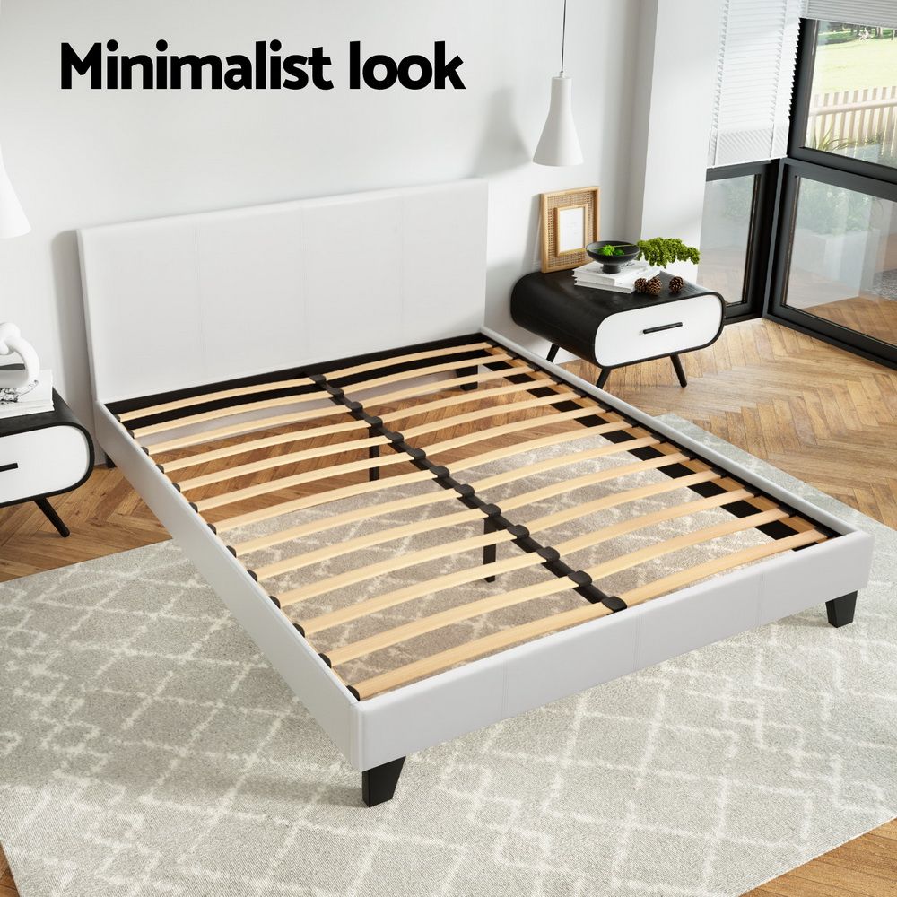 White upholstered PVC leather Neo Queen Bed Frame by The Willow Stone Collective with a modern upholstered design.