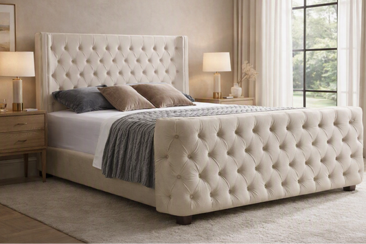 Cream velvet king bed frame with tufted headboard and endboard, featuring elegant design by The Willow Stone Collective.