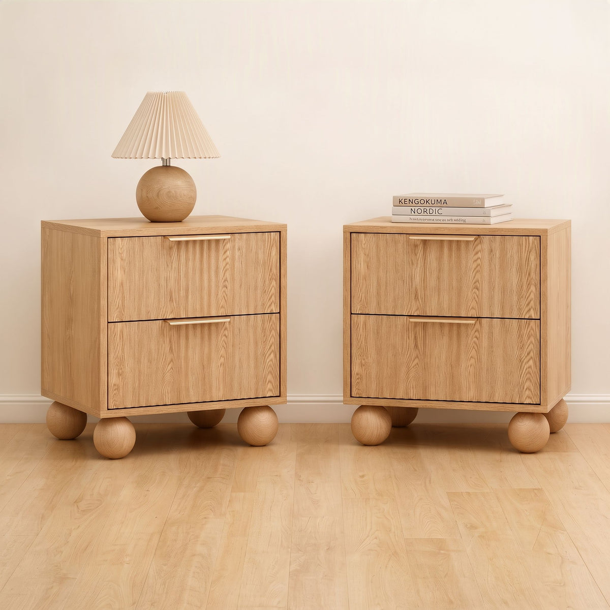 Pine bedside table with drawers featuring rounded legs and a warm, natural finish in an elegant bedroom setting.