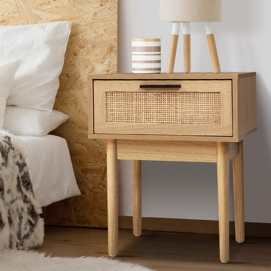 Rattan bedside table with drawers featuring a natural wood finish and woven texture, perfect for modern Australian decor.