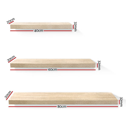 Sturdy oak floating wall shelf set in three sizes from The Willow Stone Collective, ideal for living room storage and decor.