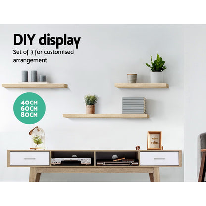 Sturdy oak floating wall shelf set with three sizes, modern furniture piece for living room storage by The Willow Stone Collective.