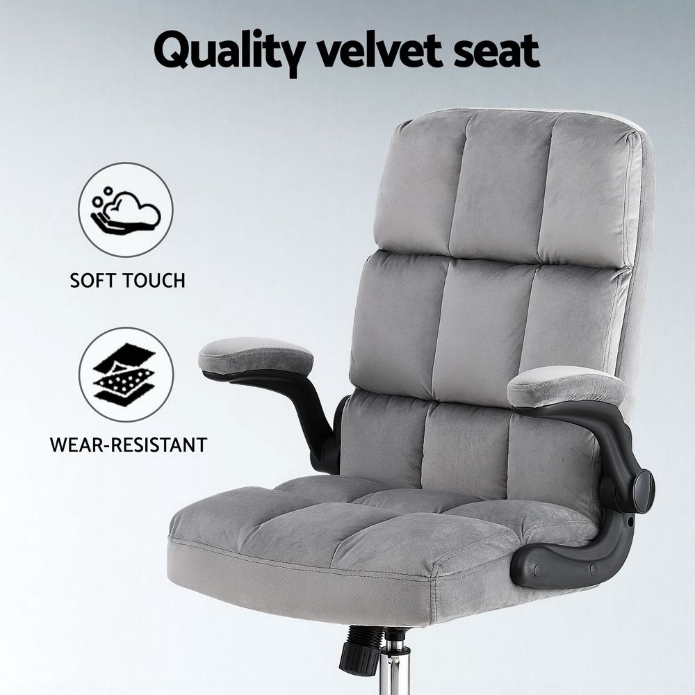 Grey velvet office chair with adjustable armrests and modern design by The Willow Stone Collective.