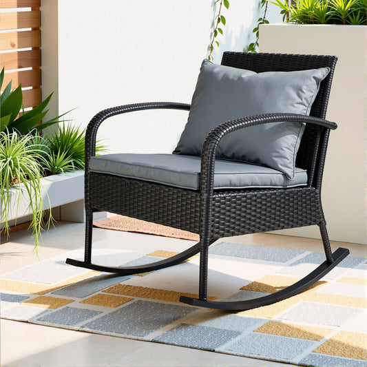 Black weather-resistant wicker outdoor rocking chair with cushions by Gardeon, perfect for relaxing outside.