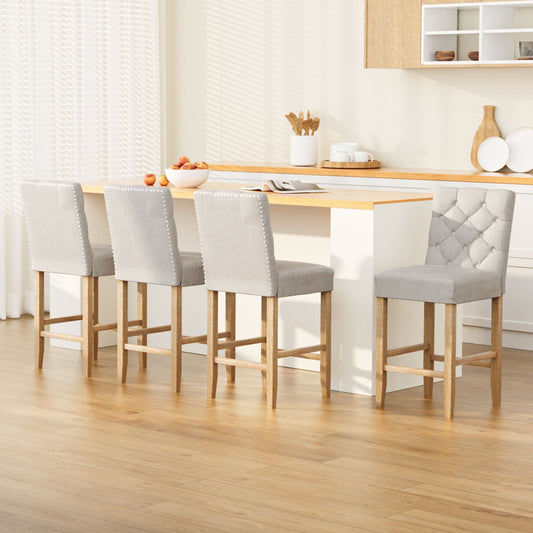 Stylish TWSC linen upholstered bar stools featuring tufted backs and wooden legs in a modern kitchen setting.