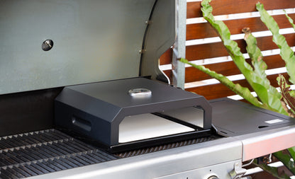 The Willow Stone Collective Pizza Oven Box with built-in thermometer and included pizza stone, designed for outdoor cooking.