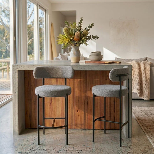Set of two Elsa grey boucle upholstered low bar stools with steel frames by The Willow Stone Collective, modern furniture for kitchen or bar.