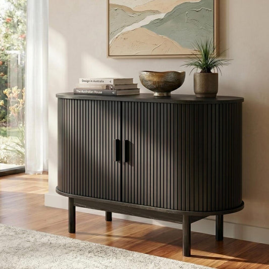 Black mid-century modern sideboard cabinet with ribbed design, crafted by The Willow Stone Collective.
