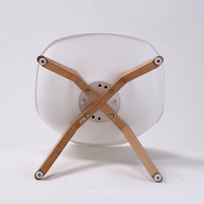 Set of four retro dining chairs with padded white seats and beech wood legs from The Willow Stone Collective.