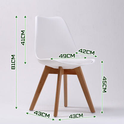 Set of four retro dining chairs with padded white seats and beech wood legs from The Willow Stone Collective.