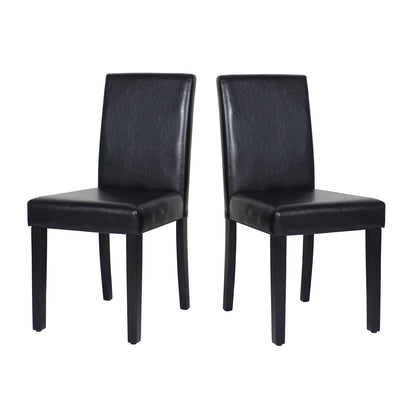 Set of two wooden dining chairs with black leatherette seats and solid pine legs from The Willow Stone Collective.