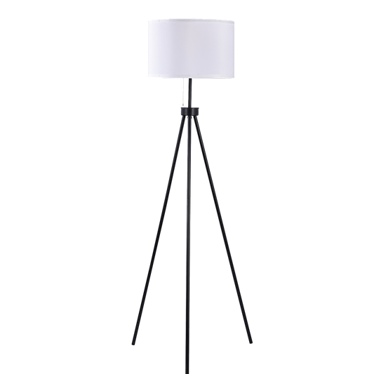 Black metal mid-century tripod floor lamp with ivory fabric shade from The Willow Stone Collective, standing in a home interior.