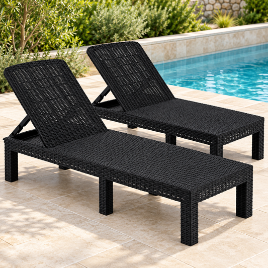 black folding sun loungers pair in an outdoor setting.
