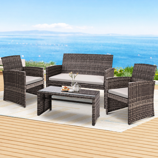 4-Piece Outdoor Rattan Sofa Set with Storage Cover – Grey styled in a lifestyle setting