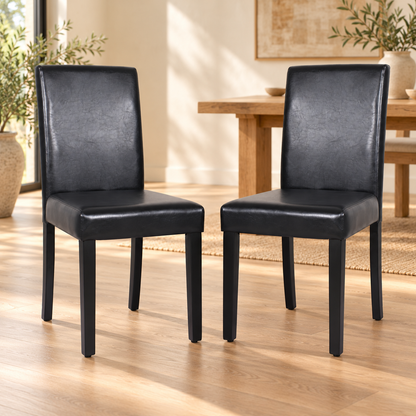 Wooden Dining Chairs Set of 2 – Black Leatherette, Solid Pine Legs styled in a warm modern dining room
